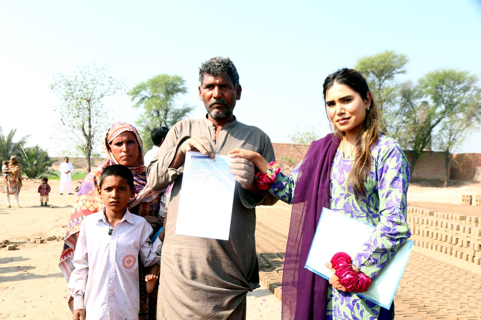 A family holding their signed debt settlement paperwork