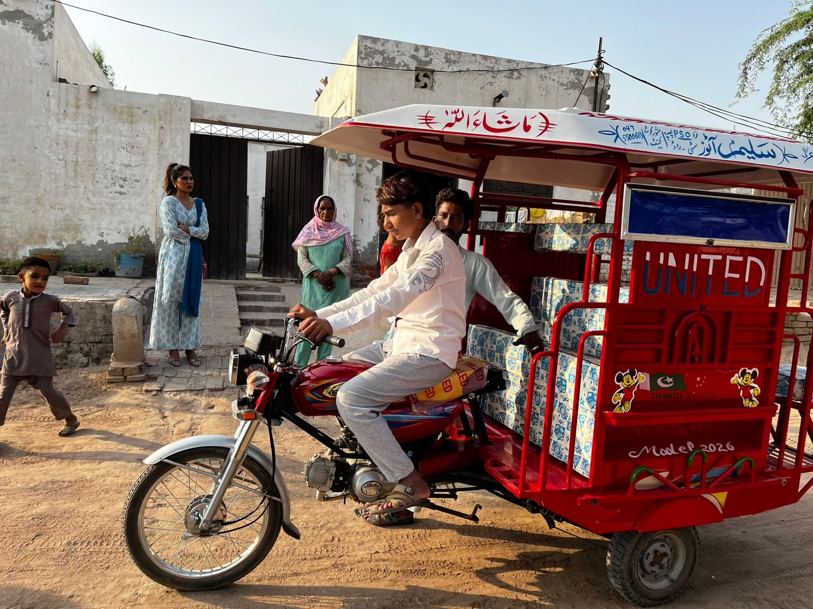 Kashif with the rickshaw that now provides his family's income